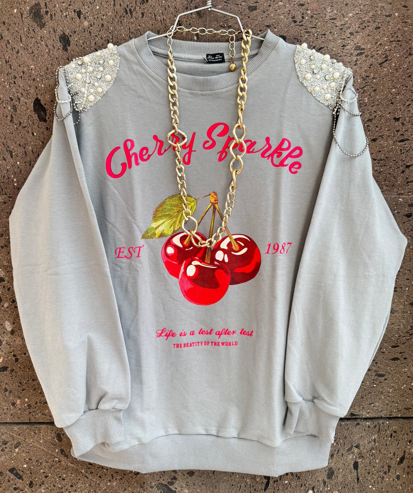 A sudadera Cherry brillos